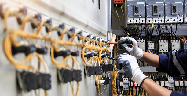 Professional Electrical Panel Upgrade technician working in Marion County County, IA